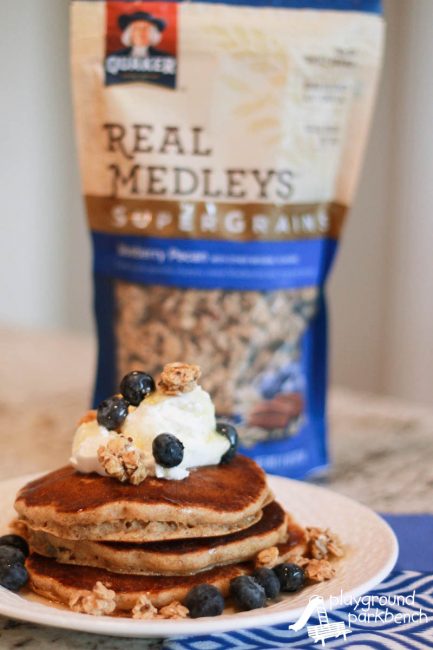 Whole Grain Blueberry Pecan Granola Pancakes featuring Quaker® Real Medleys SuperGrains Granola create a protein, fiber and flavor-filled breakfast to get your day off to a healthy, hearty start! The whole family with love the texture and taste of this tasty breakfast!