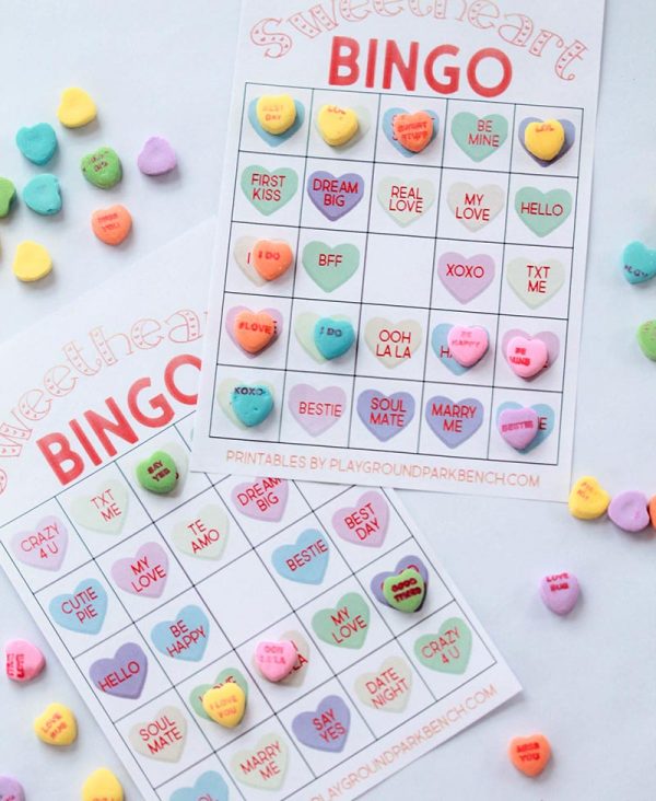 Our Valentine Bingo game printable features 2 different sets of 20 unique game cards. Play the colored hearts version with at your preschool Valentine's Day party, or opt for the conversation heart phrase version for your early readers | Party Games | Valentine's Day | Kids Activities | Candy Hearts | Sweethearts | Room Mom Ideas