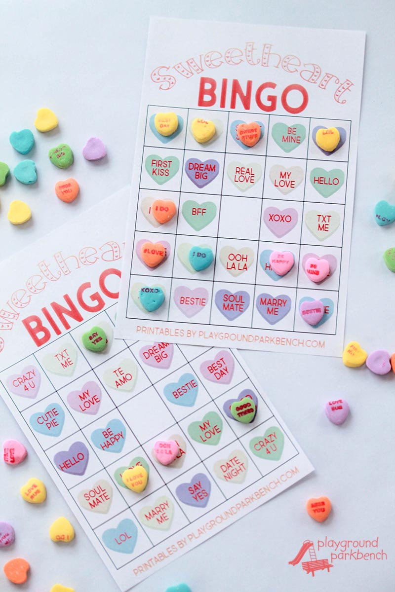 Our Valentine Bingo game printable features 2 different sets of 20 unique game cards. Play the colored hearts version with at your preschool Valentine's Day party, or opt for the conversation heart phrase version for your early readers | Party Games | Valentine's Day | Kids Activities | Candy Hearts | Sweethearts | Room Mom Ideas
